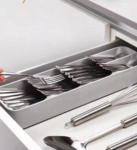 Cutlery tray box neatly arranged with different utensil types