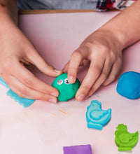 Kinetic sand set with various play tools.