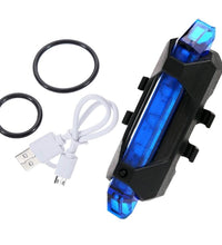 Rechargeable blue LED light for bike front, waterproof design.