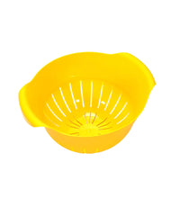 Plastic strainer bowl for easy fruit washing.