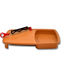 Kitchen cutting tray with integrated holder for convenience.