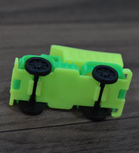 Toy truck with dump feature