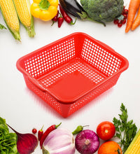 Kitchen organizer basket made of plastic, designed for washing vegetables and fruits.