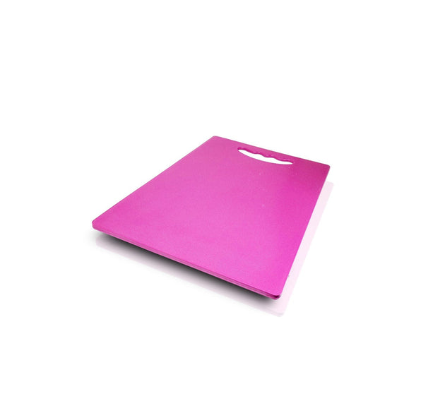 Plastic cutting board for kitchen use, ideal for chopping and slicing.