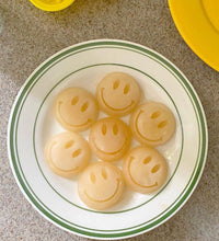 Silicone baking mold with smiley face design for chocolates