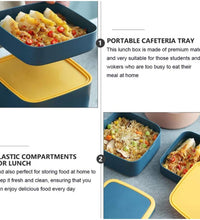 Blue lunch box with spoon and stackable layers