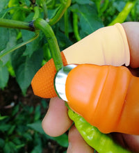 Close-up of V thumb cutter for peeling vegetables.