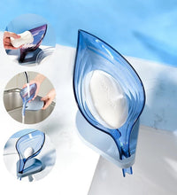 Leaf-shaped soap box with self-draining design.