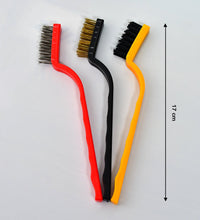 Multi-material wire brushes for cleaning hard-to-reach areas