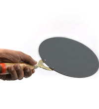 Durable nonstick tawa with wooden handle, suitable for making rotis and parathas.