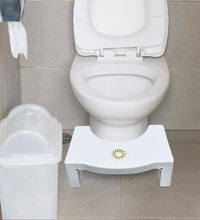 White toilet squat stool, easy to fold and non-slip for safe use.