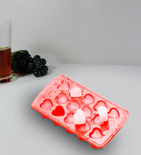 Heart-shaped silicone ice cube tray, enhances drink presentation.