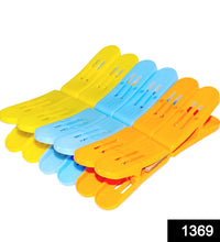 Durable plastic double pin clips in assorted colors for clothes.