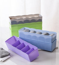 Multi-colored bead storage tray with dividers, ideal for organizing small items.