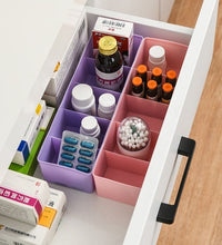 Clear bead storage tray with several compartments, showing multicolored sections.