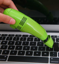 Lightweight USB mini vacuum for precise cleaning of small areas and gadgets.