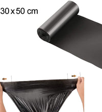 Large black garbage bags, environmentally friendly and durable.