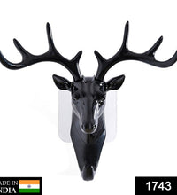 Decorative deer head hook with adhesive backing for doors