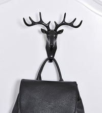 Deer head door hook with self-adhesive feature for hanging