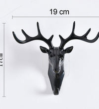 Self-adhesive deer head hanger for decorative use