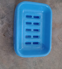 Covered plastic soap holder, helps in maintaining soap longevity.