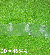 Transparent adhesive wall hook, shown in usage