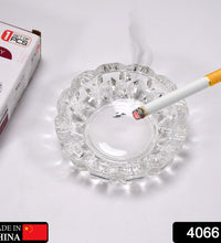 Round crystal ashtray for home or office.