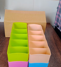 Set of 4 storage organizers with 5 compartments each for socks and handkerchiefs.