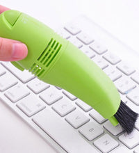 Compact and portable mini vacuum cleaner for targeted cleaning of electronic devices.