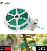 Green plastic twist tie spool for garden plants with attached cutter.