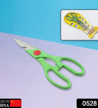 Close-up of kitchen scissors with sharp blades and bottle opener feature.