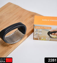 Heavy-duty stainless steel garlic presser for easy crushing.