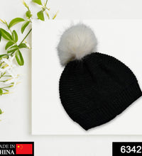 Winter woolen beanie cap with black fur lining.