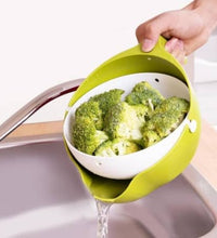 Strainer bowl with handle for easy washing of fruits and vegetables.