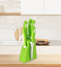 Ergonomic kitchen knife and peeler set with holder.