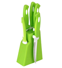 Complete kitchen knife and peeler set with stand.