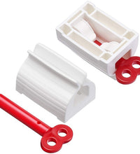 Toothpaste squeezer and holder stand for rolling tubes