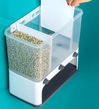 Wall-mounted cereal dispenser in use