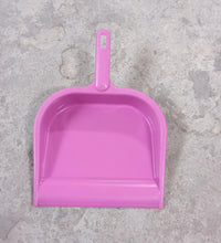 Plastic dustpan with handle, suitable for multiple cleaning tasks.