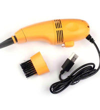 Portable USB vacuum cleaner ideal for keyboards, laptops, and car interiors.