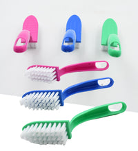 Multi-use cleaning brushes for kitchen tasks, including fish and vegetable cleaning.