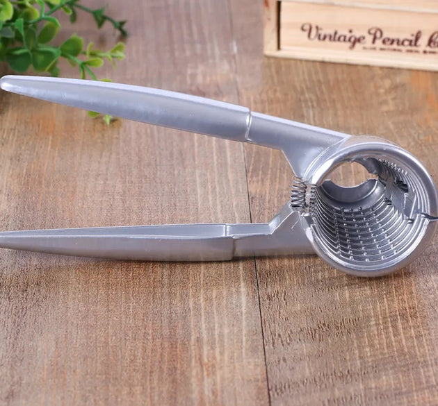 Close-up of a luxury stainless steel walnut cracker with ergonomic design