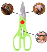 Detailed view of multi-function kitchen scissors used for cutting veggies and opening bottles.