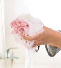 Round loofah sponge for exfoliating and scrubbing