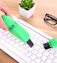 Multi-use mini vacuum cleaner for car and computer cleaning, powered via USB.