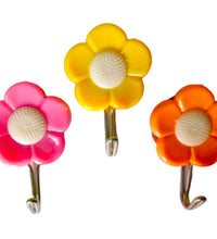 Colorful flower wall hooks for organizing small items.