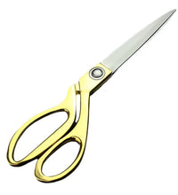 Gold-plated professional scissors for cutting cloth.