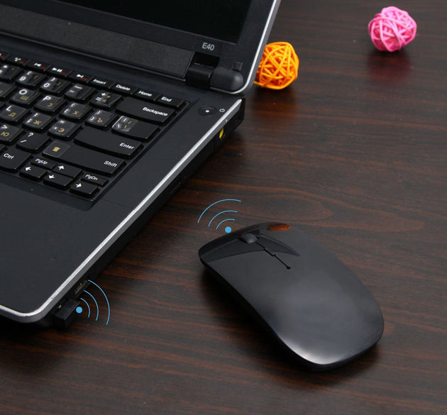 Wireless mouse for laptop, PC, Mac, and iPad, sleek design.