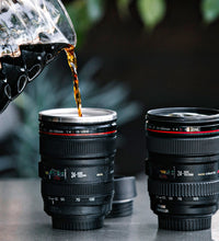 Coffee mug designed like a camera lens, made of stainless steel with intricate detailing