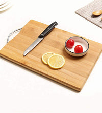 Wooden chopping board with anti-slip mat for safety.